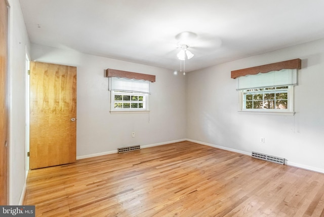 unfurnished room with ceiling fan and light hardwood / wood-style floors