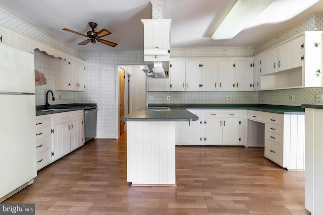 kitchen with white cabinetry, white refrigerator, sink, decorative backsplash, and dishwasher