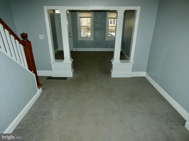 unfurnished living room featuring carpet floors