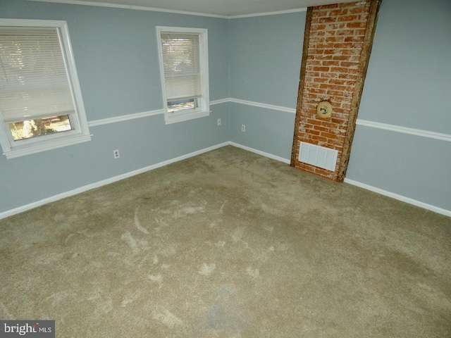 carpeted empty room with ornamental molding