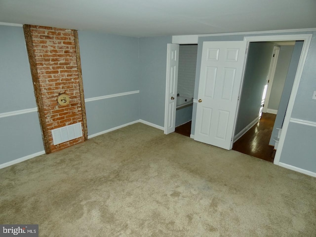 unfurnished bedroom with crown molding and carpet flooring