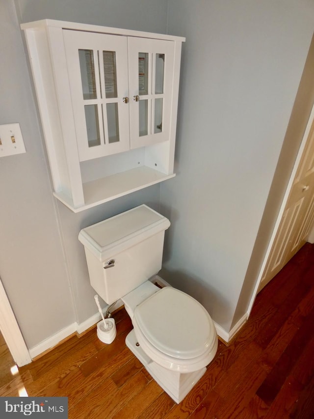 bathroom featuring toilet and hardwood / wood-style floors