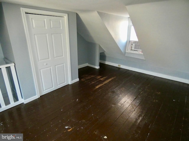 bonus room with dark hardwood / wood-style floors