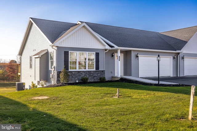 view of front of house featuring a garage and a front lawn