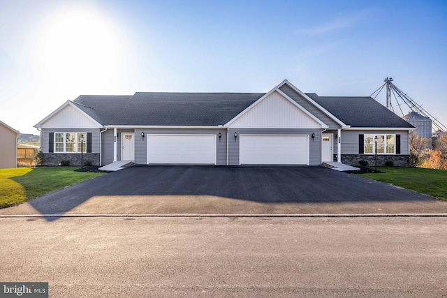 view of front of house featuring a garage and a front yard