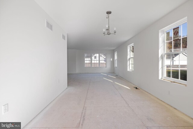 hallway with a chandelier