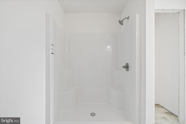 bathroom featuring walk in shower