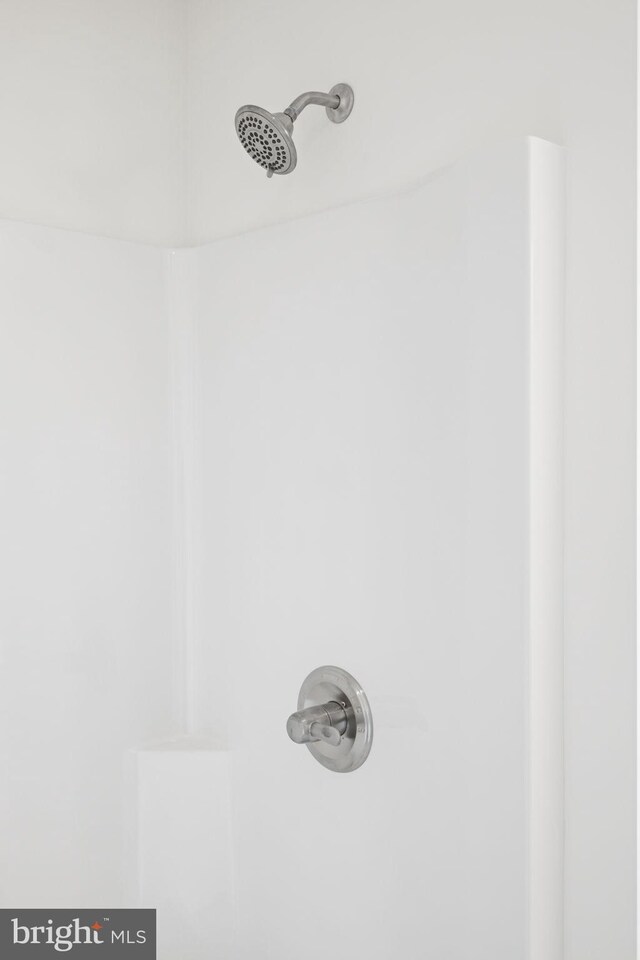 interior details with a shower