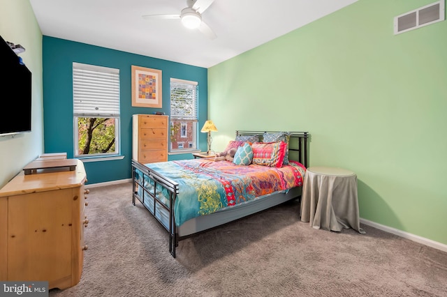 carpeted bedroom with ceiling fan