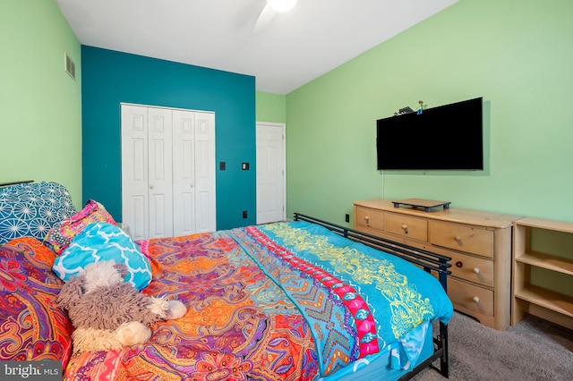 carpeted bedroom with a closet and ceiling fan