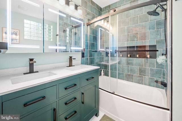 bathroom with combined bath / shower with glass door and vanity