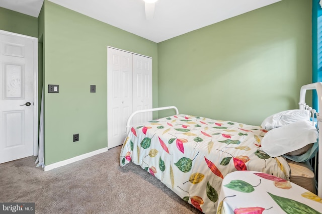 bedroom with ceiling fan, a closet, and carpet