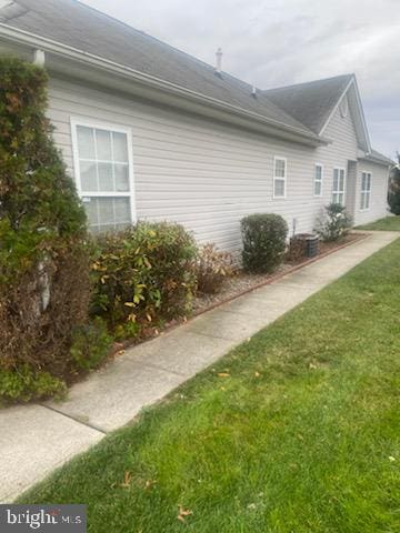 view of home's exterior featuring a lawn