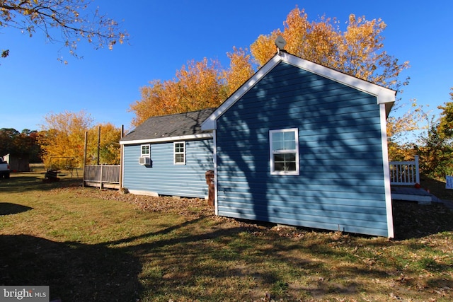 view of side of property featuring a yard