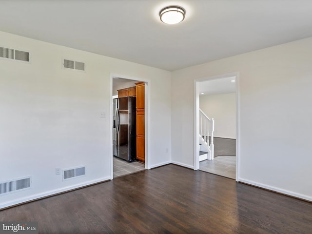 empty room featuring wood-type flooring