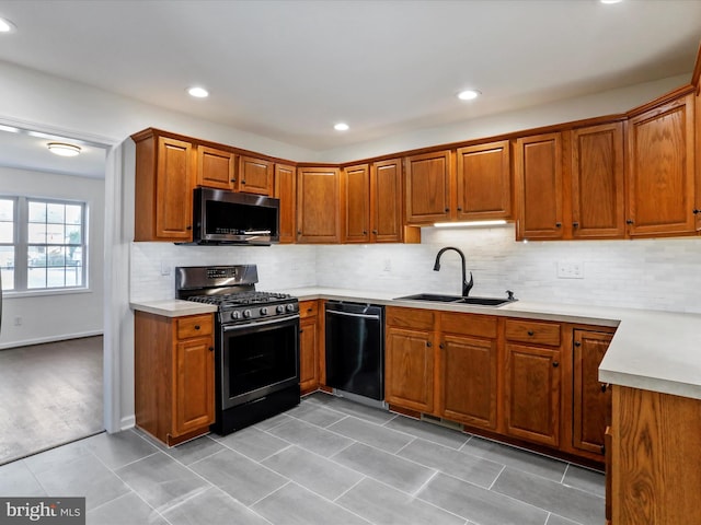 kitchen featuring backsplash, stainless steel appliances, and sink