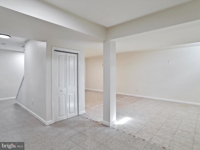 basement featuring light tile patterned floors