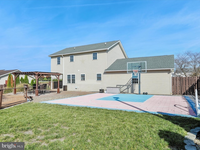 back of house with a patio area, a deck, a lawn, and a pergola