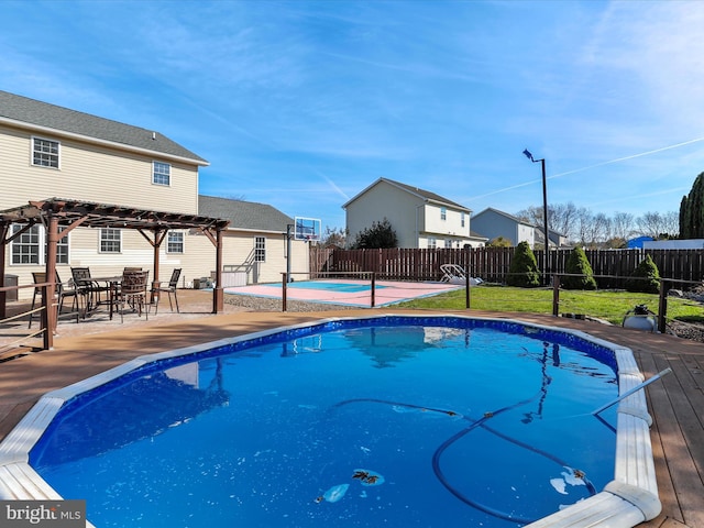 view of swimming pool featuring a yard, a patio area, and a pergola