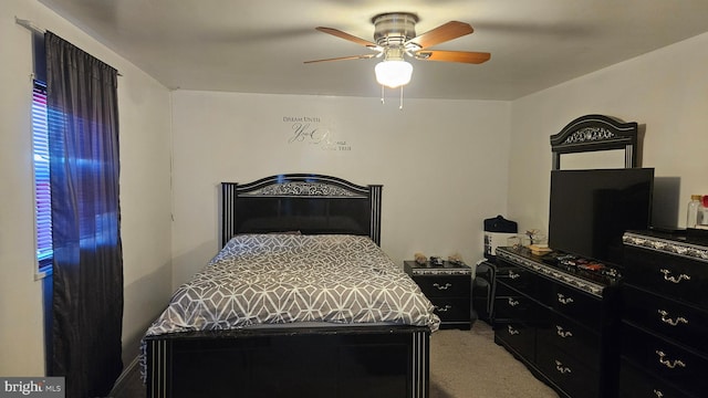 carpeted bedroom with ceiling fan