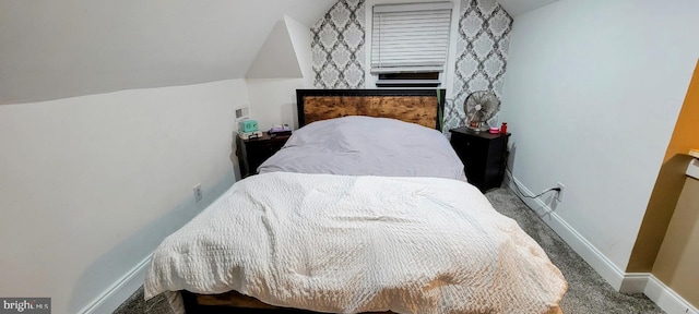 bedroom with carpet and vaulted ceiling