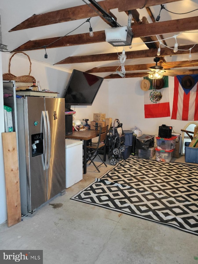 interior space featuring concrete floors, beam ceiling, and ceiling fan