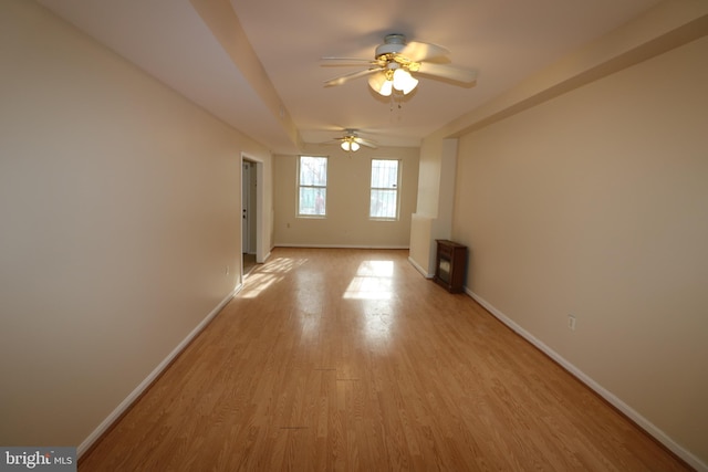 unfurnished room featuring light hardwood / wood-style floors and ceiling fan