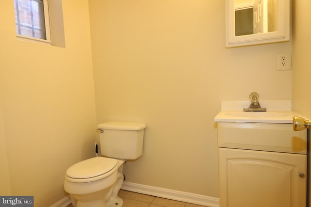 bathroom featuring vanity, toilet, and tile patterned floors