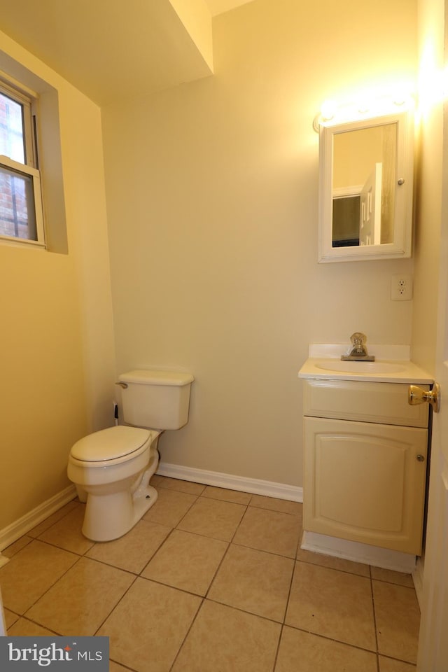 403 O St NW, Washington, DC 20001 - bathroom with tile patterned floors, toilet, baseboards, and vanity