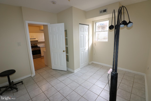 interior space featuring light tile patterned flooring