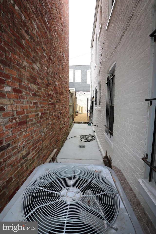 403 O St NW, Washington, DC 20001 - view of side of home featuring central AC unit and brick siding