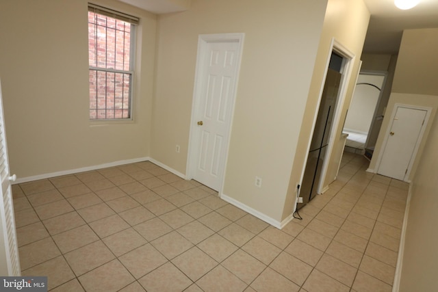 empty room featuring light tile patterned floors