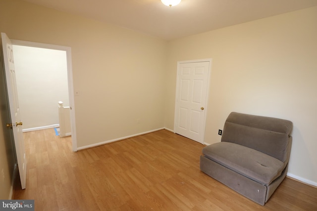 sitting room featuring light wood-type flooring