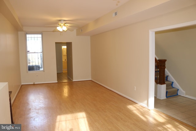 403 O St NW, Washington, DC 20001 - unfurnished room with baseboards, visible vents, ceiling fan, light wood-style floors, and stairway