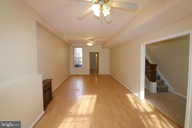 unfurnished living room featuring light hardwood / wood-style floors and ceiling fan