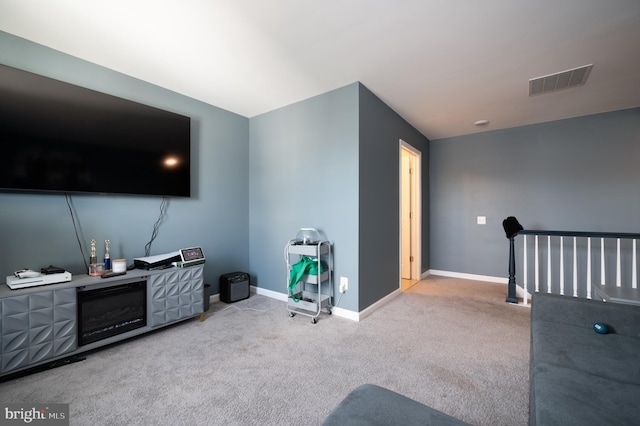 living room featuring light carpet