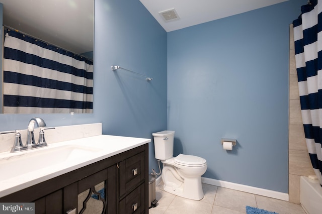 full bathroom featuring tile patterned flooring, vanity, shower / tub combo, and toilet