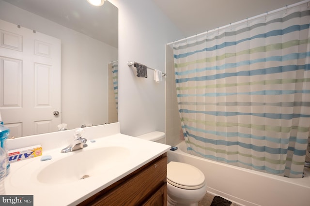 full bathroom featuring vanity, toilet, and shower / bathtub combination with curtain