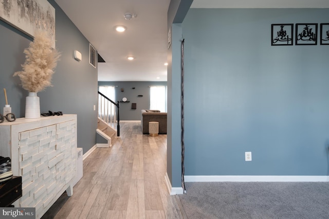 corridor featuring light hardwood / wood-style flooring