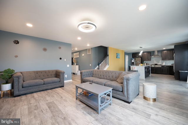 living room with light hardwood / wood-style floors