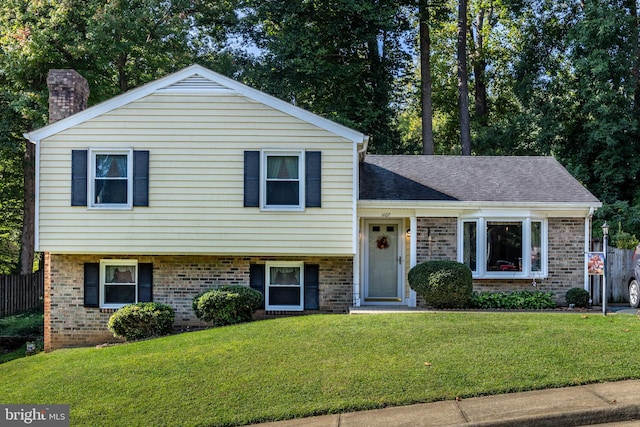 split level home with a front yard