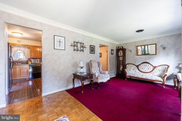 living area with crown molding, dark parquet floors, and sink