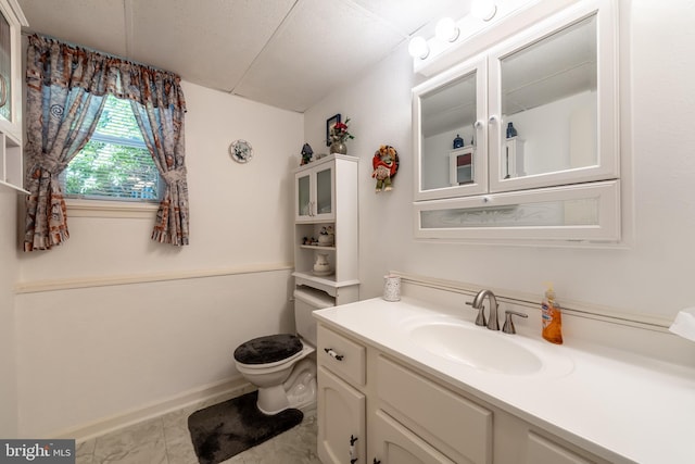 bathroom featuring toilet and vanity