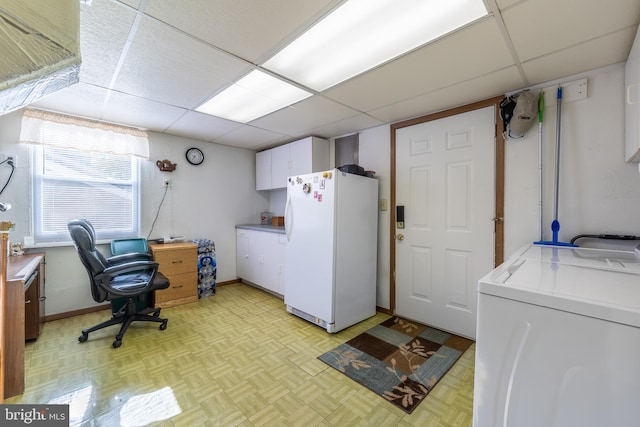 laundry area featuring washer / dryer and light parquet flooring