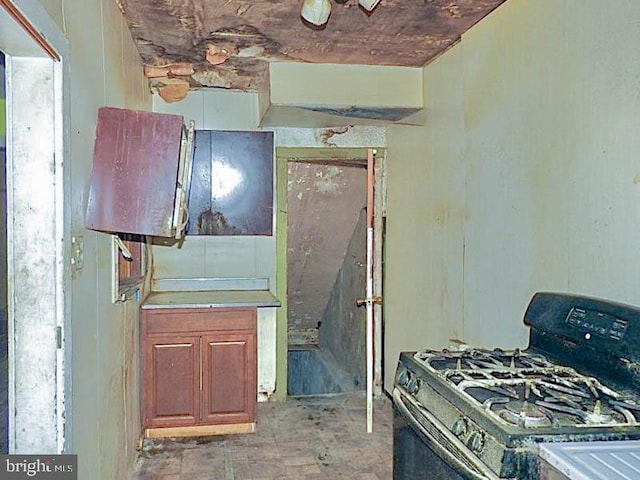 kitchen with black gas range oven