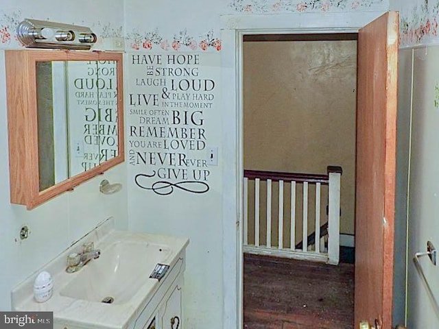 bathroom with vanity and hardwood / wood-style floors