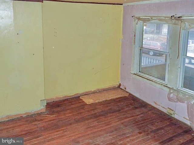 empty room with wood-type flooring