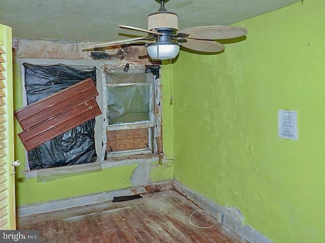 interior details with ceiling fan and wood-type flooring