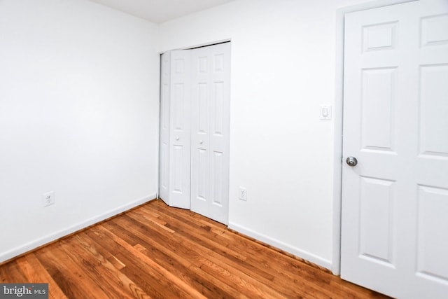 unfurnished bedroom featuring wood-type flooring