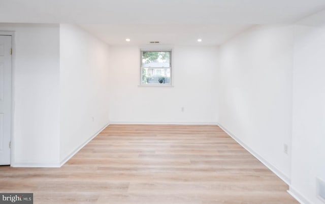 basement featuring light hardwood / wood-style floors